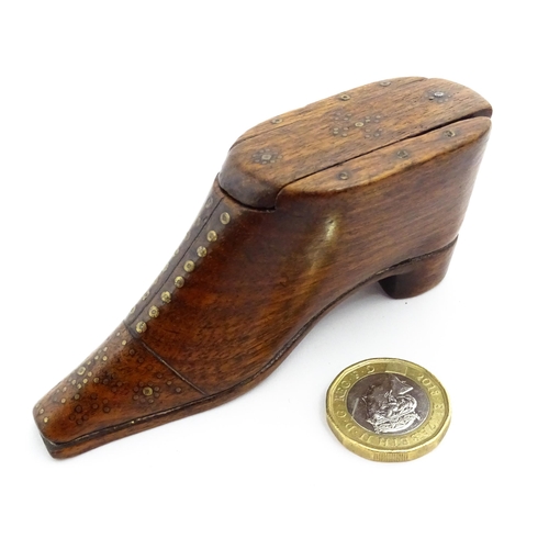 1357 - Treen : A 19thC shoe snuff box with sliding lid and inlaid brass studwork decoration. Approx. 3 3/4