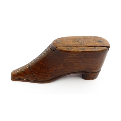 1357 - Treen : A 19thC shoe snuff box with sliding lid and inlaid brass studwork decoration. Approx. 3 3/4