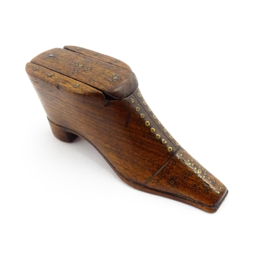 1357 - Treen : A 19thC shoe snuff box with sliding lid and inlaid brass studwork decoration. Approx. 3 3/4