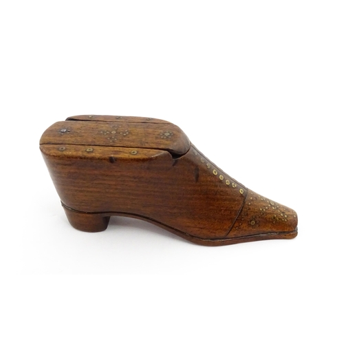 1357 - Treen : A 19thC shoe snuff box with sliding lid and inlaid brass studwork decoration. Approx. 3 3/4