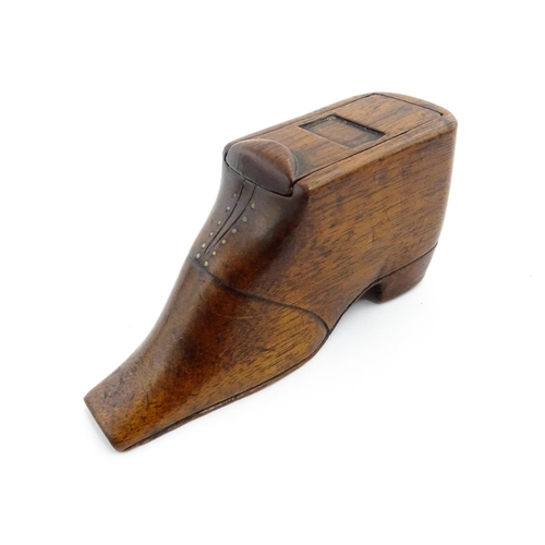 1358 - Treen : A 19thC shoe snuff box with sliding lid and brass studwork, and incised decoration. Approx. ... 