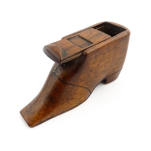 1358 - Treen : A 19thC shoe snuff box with sliding lid and brass studwork, and incised decoration. Approx. ... 