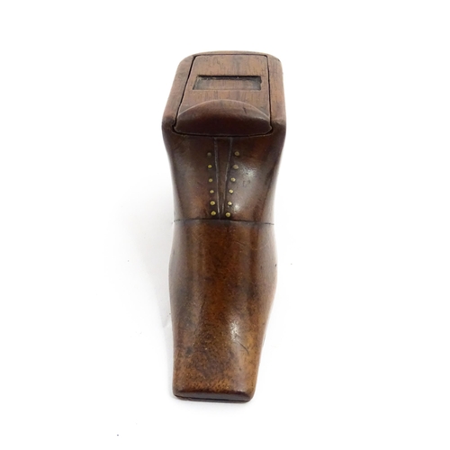 1358 - Treen : A 19thC shoe snuff box with sliding lid and brass studwork, and incised decoration. Approx. ... 