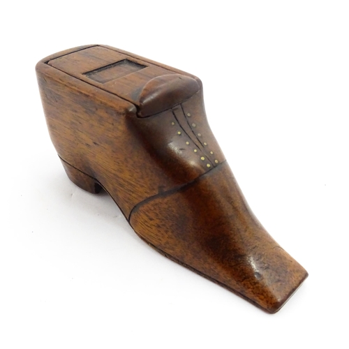 1358 - Treen : A 19thC shoe snuff box with sliding lid and brass studwork, and incised decoration. Approx. ... 