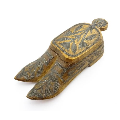 1360 - Treen : A 19thC Continental double shoe snuff box modelled as a pair of shoes with crosshatched foli... 