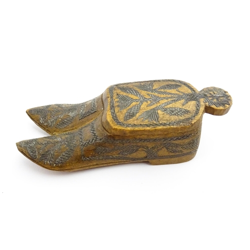 1360 - Treen : A 19thC Continental double shoe snuff box modelled as a pair of shoes with crosshatched foli... 