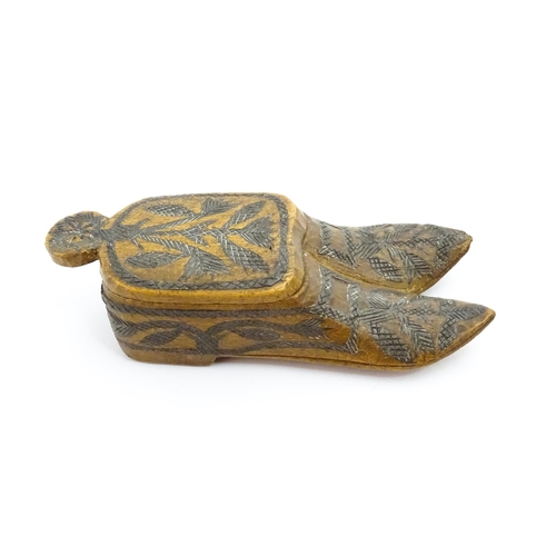 1360 - Treen : A 19thC Continental double shoe snuff box modelled as a pair of shoes with crosshatched foli... 