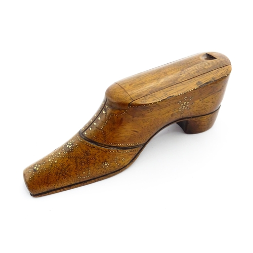 1361 - Treen : A large late 19thC shoe snuff box / table snuff with sliding lid and inlaid brass studwork d... 