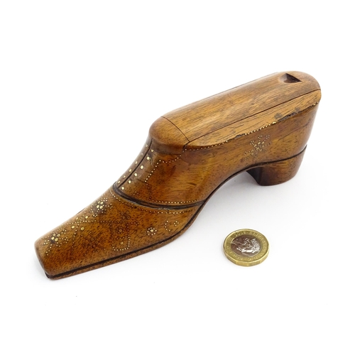 1361 - Treen : A large late 19thC shoe snuff box / table snuff with sliding lid and inlaid brass studwork d... 