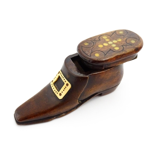 1362 - Treen : A 19thC shoe snuff box with sliding lid, applied buckle detail and inlaid roundel detail to ... 