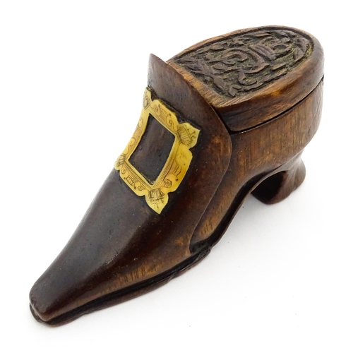 1363 - Treen : An early 20thC shoe snuff box of boot form with sliding lid, applied penwork buckle detail a... 