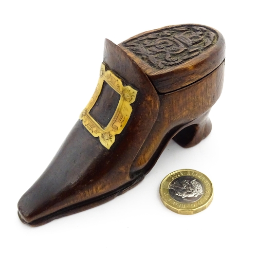 1363 - Treen : An early 20thC shoe snuff box of boot form with sliding lid, applied penwork buckle detail a... 