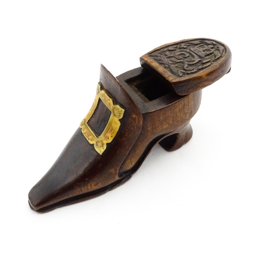 1363 - Treen : An early 20thC shoe snuff box of boot form with sliding lid, applied penwork buckle detail a... 