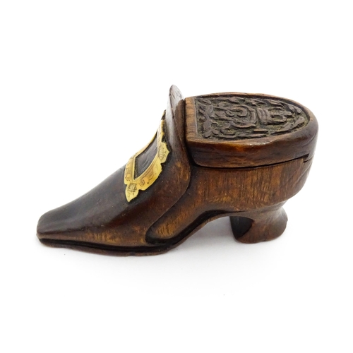 1363 - Treen : An early 20thC shoe snuff box of boot form with sliding lid, applied penwork buckle detail a... 