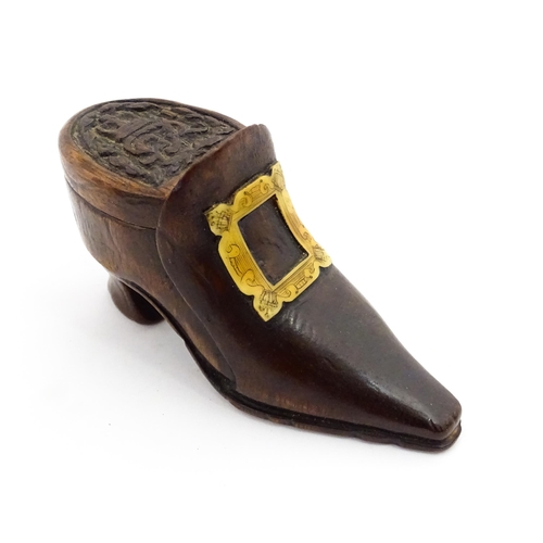 1363 - Treen : An early 20thC shoe snuff box of boot form with sliding lid, applied penwork buckle detail a... 