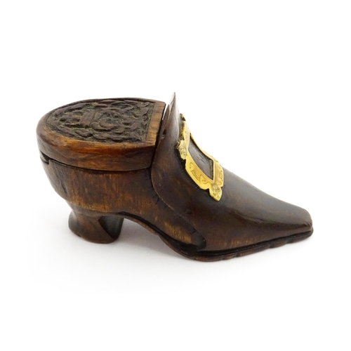 1363 - Treen : An early 20thC shoe snuff box of boot form with sliding lid, applied penwork buckle detail a... 