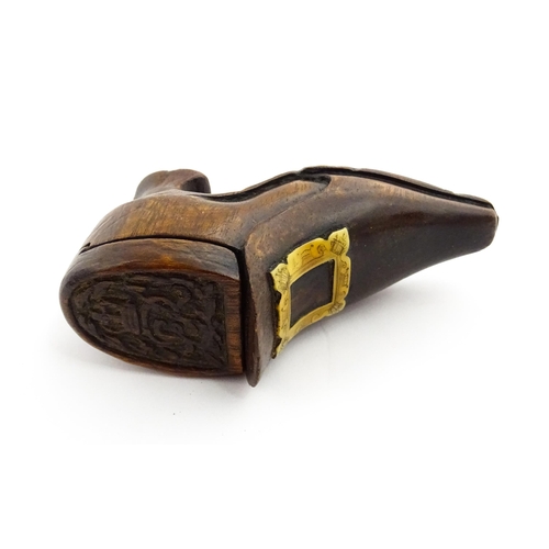 1363 - Treen : An early 20thC shoe snuff box of boot form with sliding lid, applied penwork buckle detail a... 