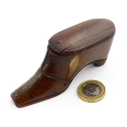 1365 - Treen : A 19thC shoe snuff box with sliding lid and inlaid brass studwork decoration. Approx. 3 3/4