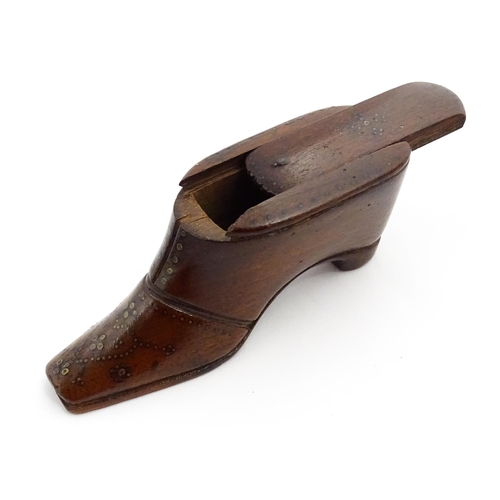 1365 - Treen : A 19thC shoe snuff box with sliding lid and inlaid brass studwork decoration. Approx. 3 3/4