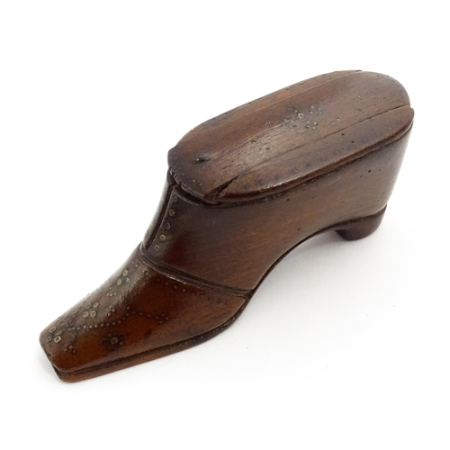 1365 - Treen : A 19thC shoe snuff box with sliding lid and inlaid brass studwork decoration. Approx. 3 3/4