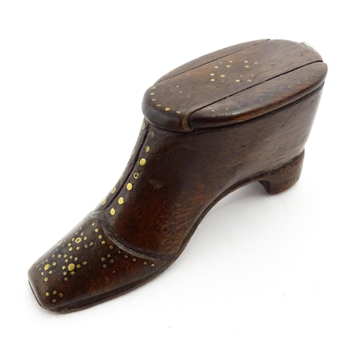 1367 - Treen : A 19thC shoe snuff box with sliding lid and inlaid brass studwork decoration. Approx. 3 1/2