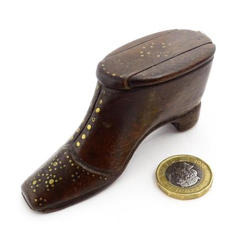 1367 - Treen : A 19thC shoe snuff box with sliding lid and inlaid brass studwork decoration. Approx. 3 1/2