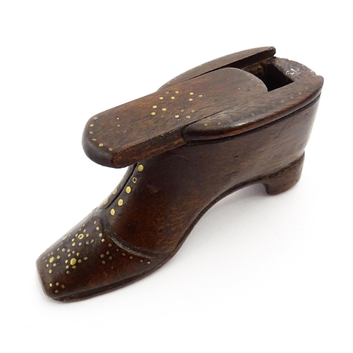 1367 - Treen : A 19thC shoe snuff box with sliding lid and inlaid brass studwork decoration. Approx. 3 1/2