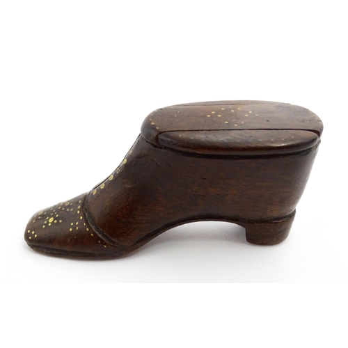 1367 - Treen : A 19thC shoe snuff box with sliding lid and inlaid brass studwork decoration. Approx. 3 1/2