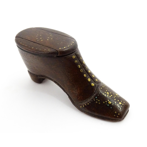 1367 - Treen : A 19thC shoe snuff box with sliding lid and inlaid brass studwork decoration. Approx. 3 1/2