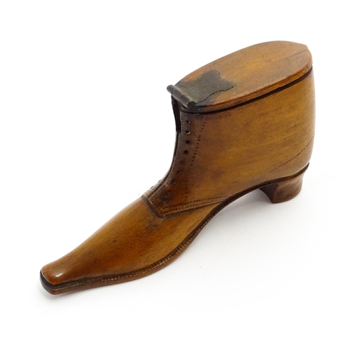 1369 - Treen : A 19thC shoe snuff box of boot form with hinged lid and incised and punchwork decoration. Ap... 