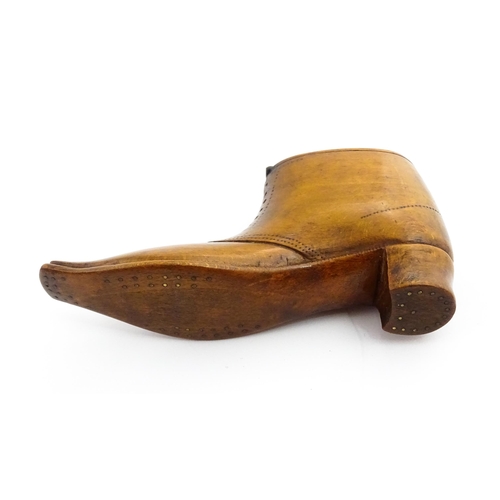 1369 - Treen : A 19thC shoe snuff box of boot form with hinged lid and incised and punchwork decoration. Ap... 