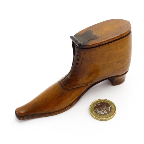 1369 - Treen : A 19thC shoe snuff box of boot form with hinged lid and incised and punchwork decoration. Ap... 