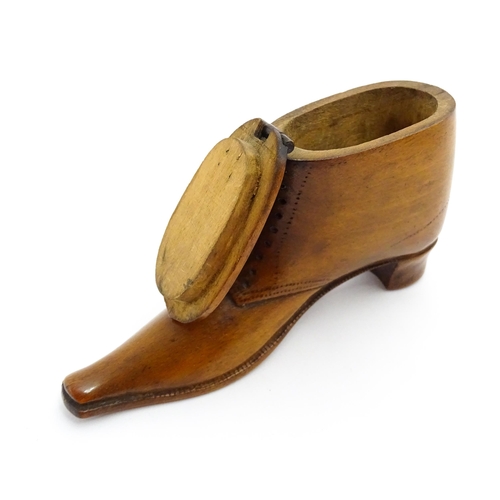 1369 - Treen : A 19thC shoe snuff box of boot form with hinged lid and incised and punchwork decoration. Ap... 