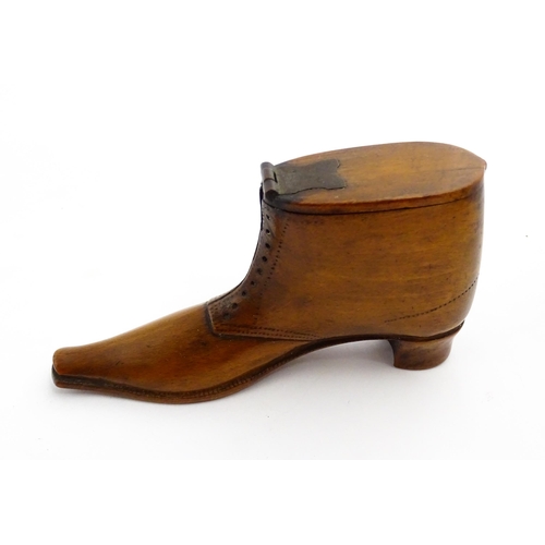 1369 - Treen : A 19thC shoe snuff box of boot form with hinged lid and incised and punchwork decoration. Ap... 