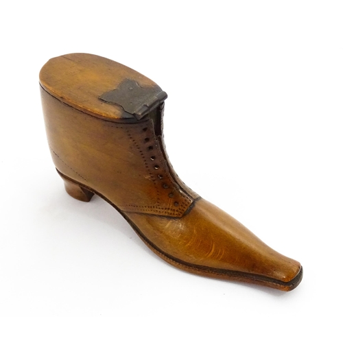 1369 - Treen : A 19thC shoe snuff box of boot form with hinged lid and incised and punchwork decoration. Ap... 