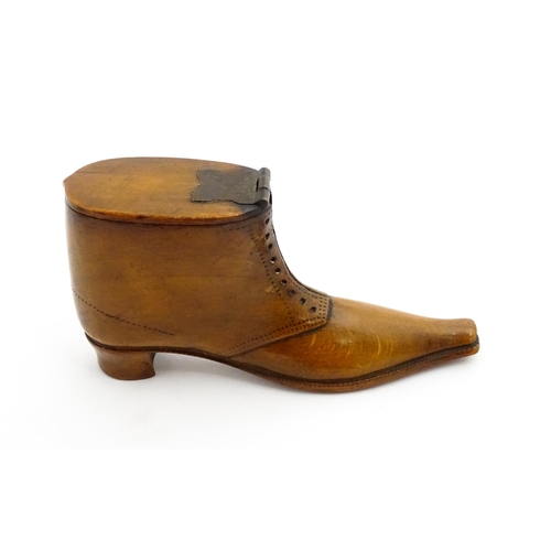 1369 - Treen : A 19thC shoe snuff box of boot form with hinged lid and incised and punchwork decoration. Ap... 