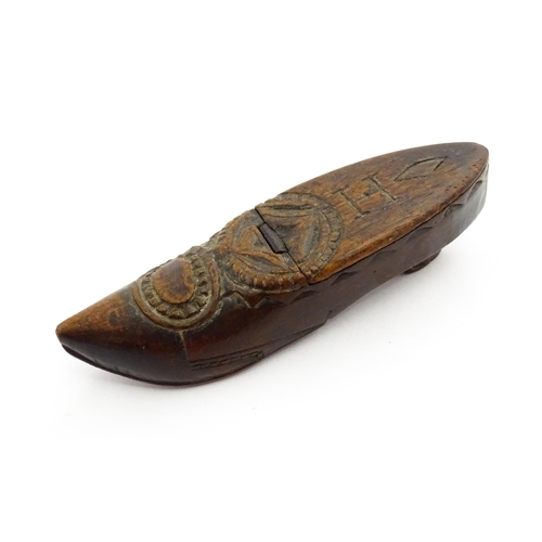 1370 - Treen : A 19thC Continental shoe snuff box with hinged lid and chip carved decoration, the lid with ... 