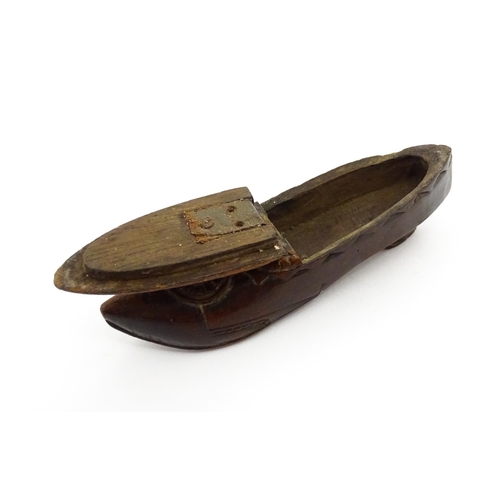 1370 - Treen : A 19thC Continental shoe snuff box with hinged lid and chip carved decoration, the lid with ... 