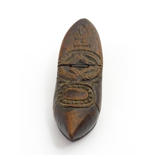 1370 - Treen : A 19thC Continental shoe snuff box with hinged lid and chip carved decoration, the lid with ... 