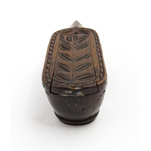 1371 - Treen : A large 19thC Continental shoe snuff box with sliding lid, and chip carved decoration with f... 