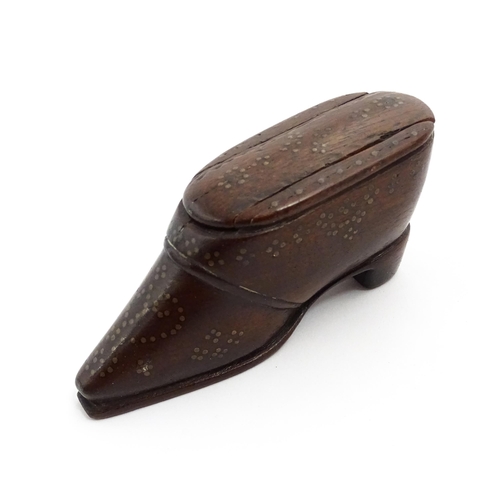 1372 - Treen : A 19thC shoe snuff box with sliding lid and inlaid brass studwork decoration. Approx. 3 1/4