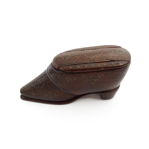 1372 - Treen : A 19thC shoe snuff box with sliding lid and inlaid brass studwork decoration. Approx. 3 1/4