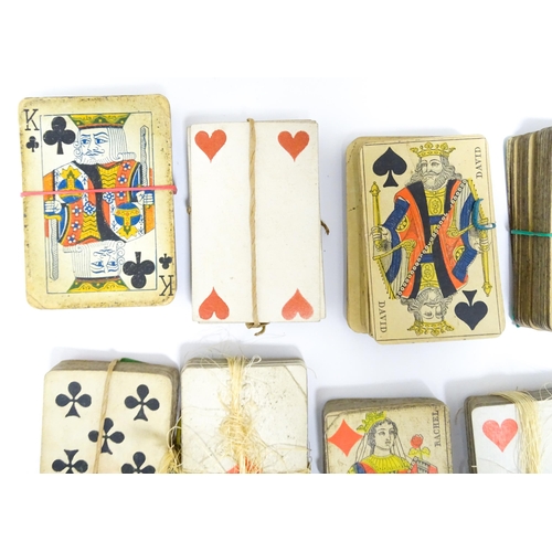 1176A - Toys: Two 20thC boxes with inlaid decoration containing assorted gaming components to include mother... 