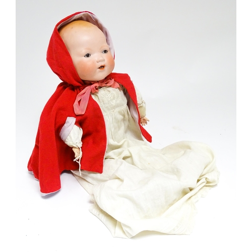 1183 - Toy: A 20thC Armand Marseille doll with bisque head, blinking eyes, painted detail, and composite ha... 