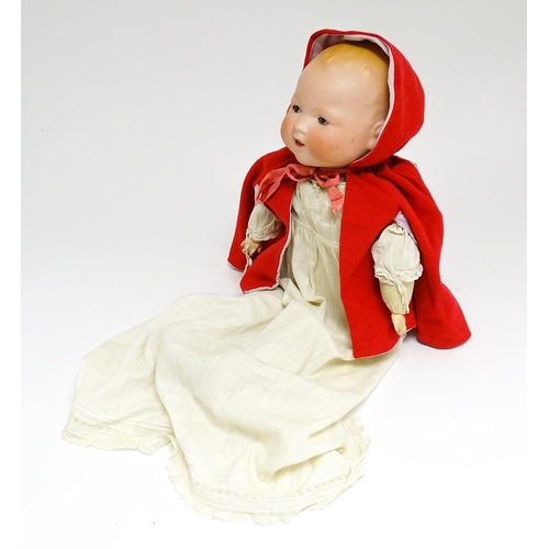 1183 - Toy: A 20thC Armand Marseille doll with bisque head, blinking eyes, painted detail, and composite ha... 