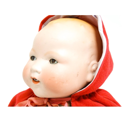 1183 - Toy: A 20thC Armand Marseille doll with bisque head, blinking eyes, painted detail, and composite ha... 