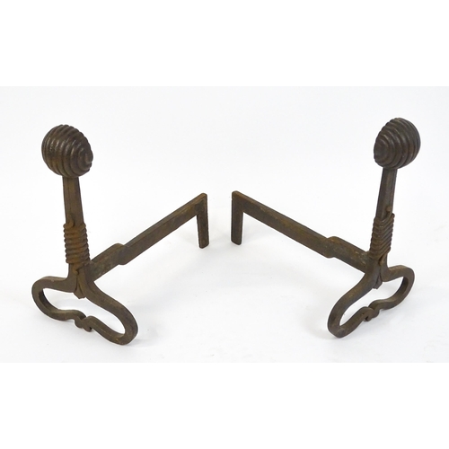 1588 - A pair of Art Nouveau cast iron andirons / firedogs, with looped bases, rope twist decoration and te... 