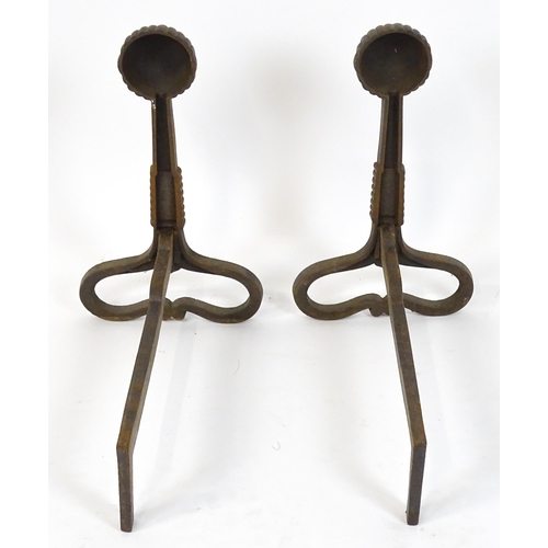 1588 - A pair of Art Nouveau cast iron andirons / firedogs, with looped bases, rope twist decoration and te... 