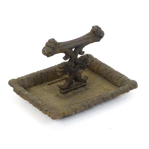 1589 - A Victorian cast iron boot scraper in the style of Coalbrookdale, the tray base supporting a short s... 