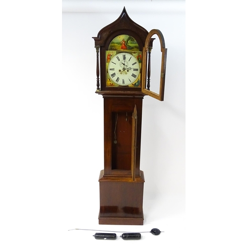 1643 - A 19thC mahogany 8-day longcase clock with arch shaped hood, the painted dial with Roman numerals, s... 